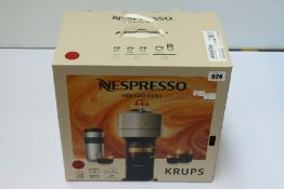 A boxed pre-owned Nespresso Vertuo Next coffee machine.
