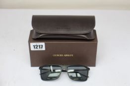 A pair of as new Giorgio Armani sunglasses.
