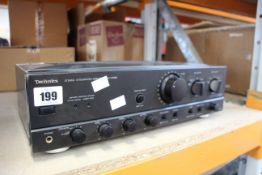A pre-owned Technics SU-VX600 stereo integrated amplifier.