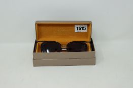 A pair of lady's boxed as new Bvlgari sunglasses (BV8226B 504/13 54).