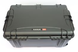 An as new Nanuk 965 waterproof wheeled case in black.