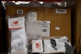 A quantity of as new New Balance socks (3 pairs per pack - approximately 50 packs).