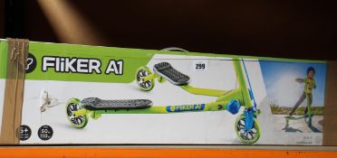 A boxed Fliker A1 kids scooter in green.