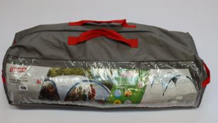 A Coleman Event Shelter Compact (10' x 10').