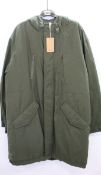An as new A.P.C. Thom fishtail parka in kaki militaire (L - RRP £315).