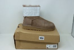 A pair of as new Ugg Mini Bailey Bow boots (UK 6).