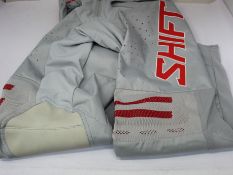A pair of as new Shift 2021 Black Label King pants in grey/red (Size 32 - RRP £149).
