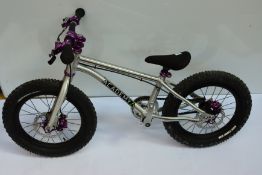 An Academy Early Rider bicycle (missing pedals).