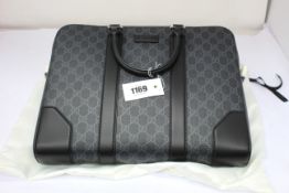An as new Gucci GG Black briefcase (RRP £1,270).