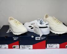 Three pairs of as new Reebok trainers; two CL Grow (UK 8,11) and a pair of Club C Revenge (UK 9).