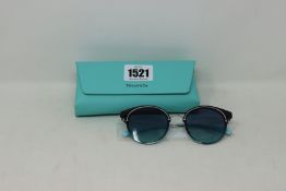A pair of lady's boxed as new Tiffany & Co. sunglasses (0TF3061 60019S 64).