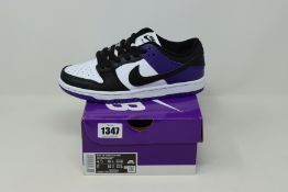 A pair of as new Nike SB Dunk Low Pro sneakers (UK 4).