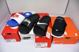 Four pairs of as new Nike sliders; Benassi JDI (UK 7), Benassi Stussy (UK 8), Benassi Swoosh (UK