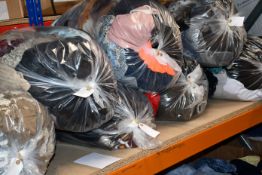 Ten bags of clothing and related items.