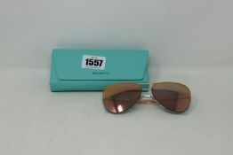 A pair of boxed as new Tiffany & CO TF 30662 sunglasses.