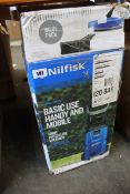 A Nilfisk Basic Use high pressure washer with a compact patio short fixed brush, both boxed.