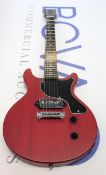 A Harley Benton DC-Junior Faded Cherry electric guitar.