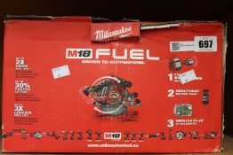 An as new Milwaukee M18 Fuel circular saw (box damaged).