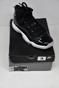 A pair of as new Nike Air Jordan 11 Retro (UK 6).