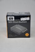 A boxed as new Black Magic Design mini converter SDI distribution.