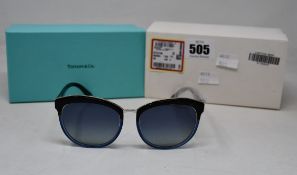 A pair of ladies boxed as new Tiffany & Co. Sunglasses (TF4146 82464L 56).