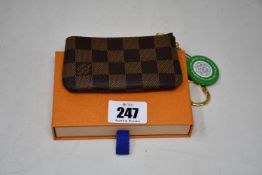 An as new Louis Vuitton key pouch (RRP £175).