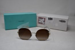 A pair of ladies boxed as new Tiffany & Co. Sunglasses (TF3071 60213B 56).