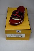A pair of as new Fendi Signature Logo Fussbett slides (UK 9).