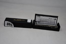 Three as new Hohner 580 Miesterklasse harmonicas (Bb, D and A).