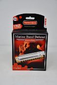 Six boxed as new Hohner Marine Band Deluxe harmonicas (Two in Ab, two in A and two in G).