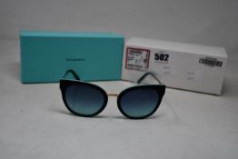 A pair of ladies boxed as new Tiffany & Co. Sunglasses (TF4168 80559S 54).