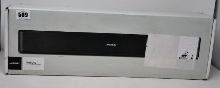 A boxed Bose Solo 5 TV Sound System.