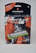 Five boxed as new Hohner Rocket progressive amp harmonica (Three in D, two in C).