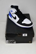 A pair of as new Nike Air Jordan 1 Mid SE (UK 9.5).