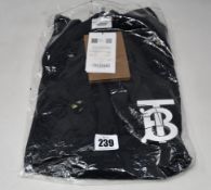 An as new Burberry Atherton long sleeved monogramed top in black (L - RRP £370 - Please note item