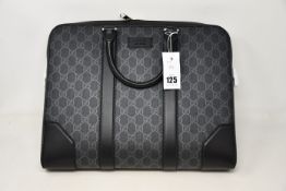 An as new Gucci GG Black briefcase (RRP £1,270).