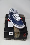 A pair of youths as new Nike Air Jordan 3 Retro (UK 3).