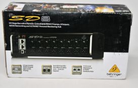 A boxed Behringer SD8 Digital Stage Box.