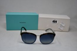 A pair of ladies boxed as new Tiffany & Co. Sunglasses (TF4146 82464L 56).