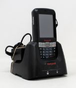 A pre-owned Honeywell Dolphin 60s Mobile Computer Barcode Scanner with cradle and power supply.