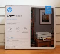 A boxed as new HP Envy 6020 All -in-one printer in white (box opened)