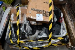 A quantity of gym weights and related items.