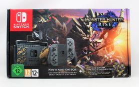 A boxed as new Nintendo Switch Lite console - Monster Hunter Rise edition (Box opened).