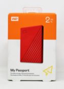 A boxed as new WD My Passport 2TB portable storage drive in red