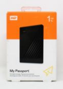 A boxed as new WD Passport 1TB Portable External Hard Drive in Black (box sealed).