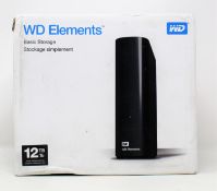A boxed as new WD Elements 12TB desktop storage drive in black (box sealed but damaged)