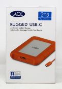 Two boxed as new Lacie 2TB Rugged USB-C storage drives in silver/orange (boxes opened) (boxes