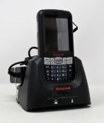 A pre-owned Honeywell Dolphin 60s Mobile Computer Barcode Scanner with cradle and power supply.