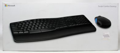 A boxed as new Microsoft Sculpt Comfort Desktop - wireless keyboard and mouse set in black/blue