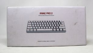 A boxed as new Anne Pro 2 White Gateron Brown Switch Gaming Keyboard (Box sealed).